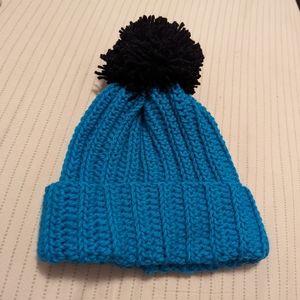 Handmade blue beanie with black pom pom